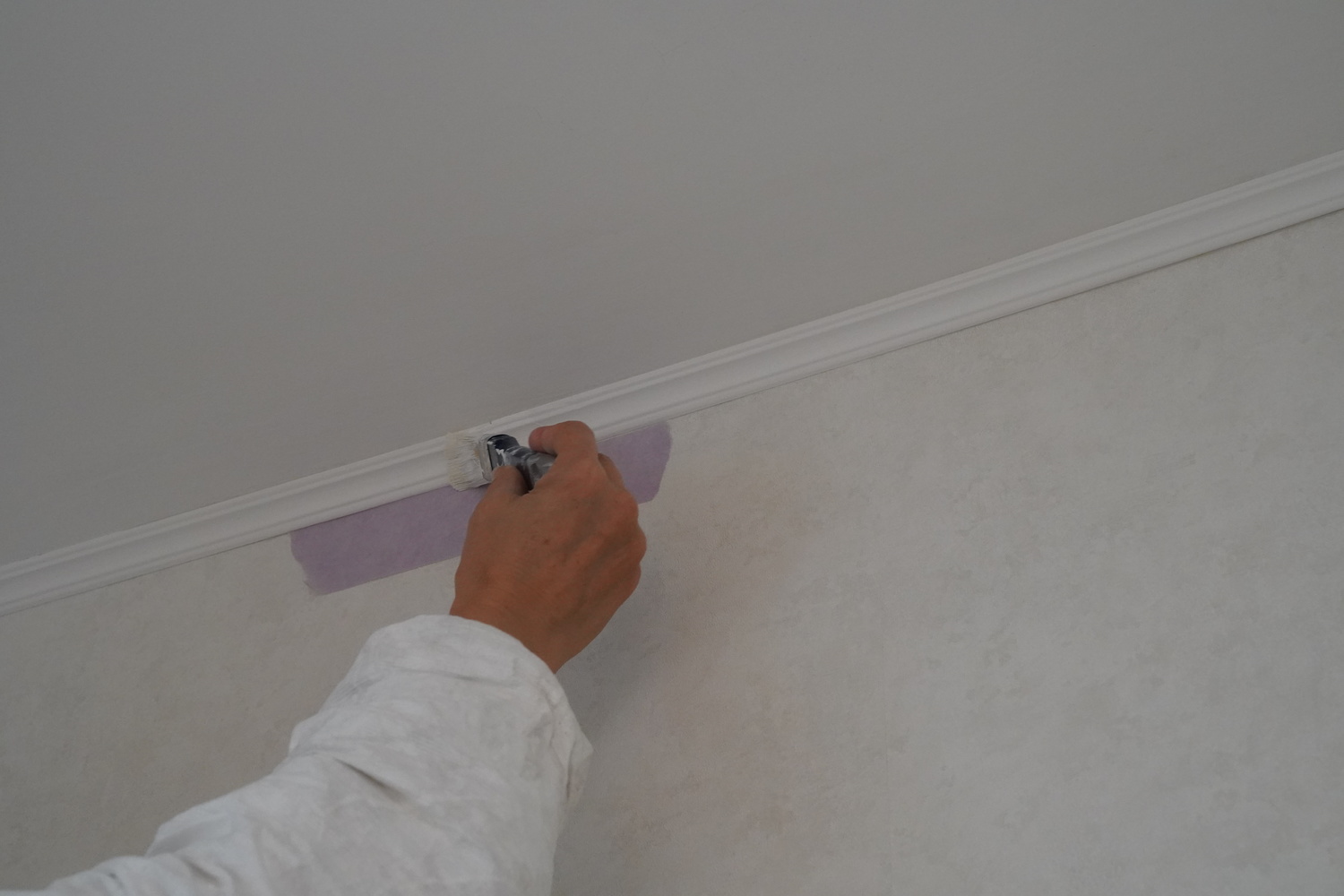 Interior wall painting with a brush